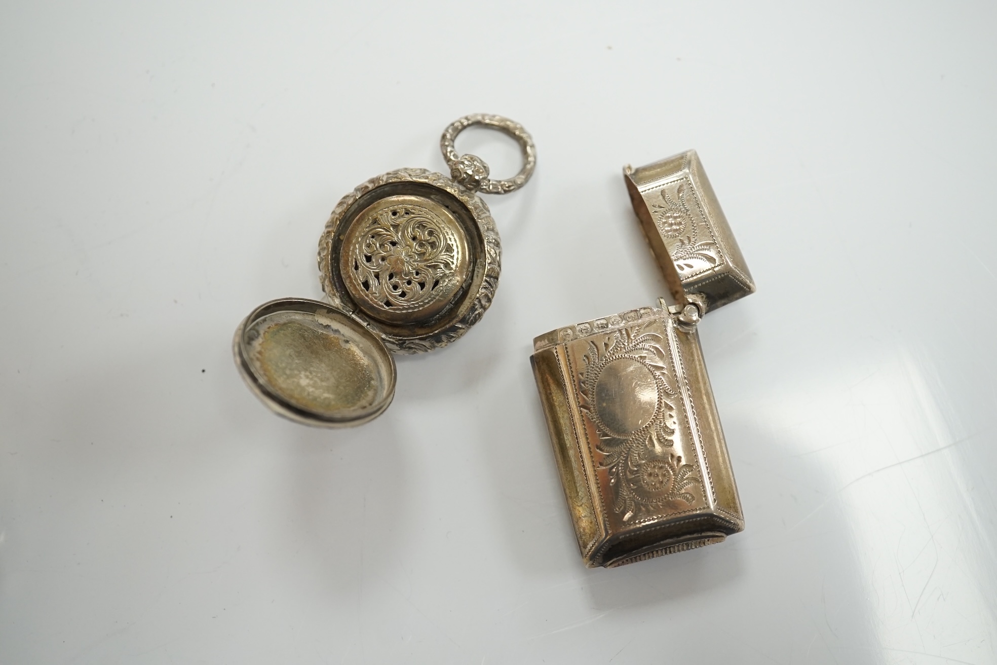 A George IV silver circular vinaigrette, Birmingham, 1822, 22mm and five other silver items including a mounted toilet jar and Victorian vinaigrette by George Unite. Condition - poor to fair